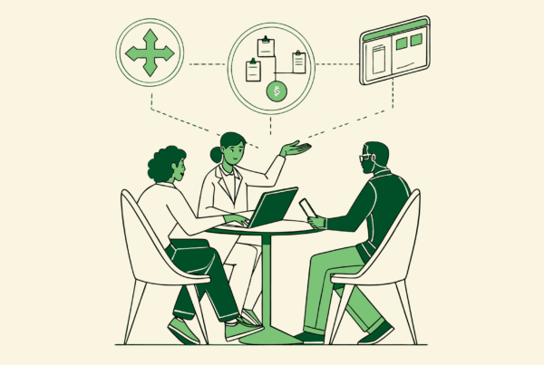 SovDoc healthcare advisors discussing nephrology practice merger strategies and financial auditing processes with data visualization, representing specialized M&A due diligence in dialysis care organizations.