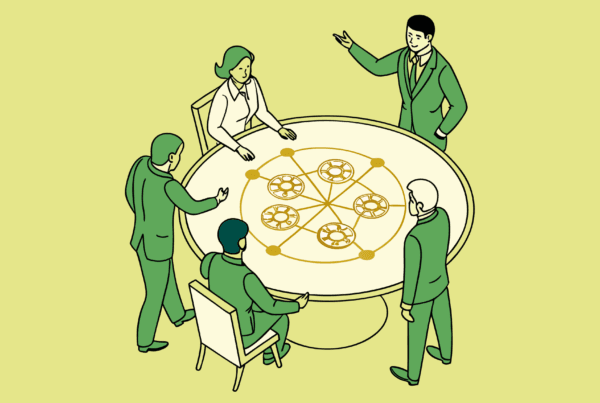 SovDoc healthcare M&A advisors collaborating around a table with neurological imagery, discussing strategic approaches for neurology practice mergers and acquisitions in the medical sector.