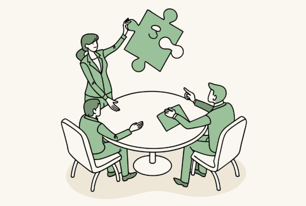 Healthcare consultants collaborating at a conference table with corporate and medical symbols, representing SovDoc's expertise in Interventional Pain practice mergers and acquisitions advisory services.