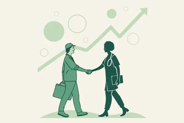 Two silhouetted figures shaking hands over rising graph, representing successful primary care practice mergers and acquisitions facilitated by SovDoc healthcare M&A advisors.