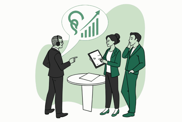 SovDoc healthcare M&A consultants discussing ENT practice valuation and acquisition strategies around a table with financial growth charts, representing medical practice valuation expertise in otolaryngology mergers and acquisitions.