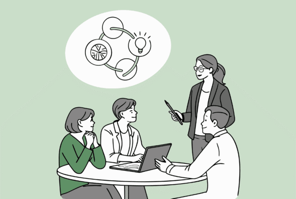 SovDoc healthcare M&A professionals collaborating around a table with holographic merger and acquisition projections, representing advisory services for business lawyers in assisted living facility medical practice transactions.