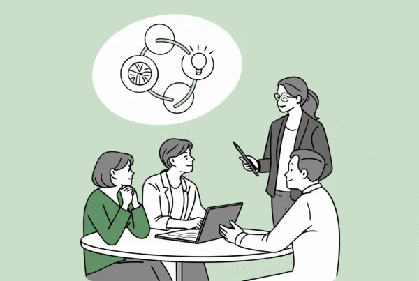 SovDoc healthcare M&A professionals collaborating around a table with holographic merger and acquisition projections, representing advisory services for business lawyers in assisted living facility medical practice transactions.