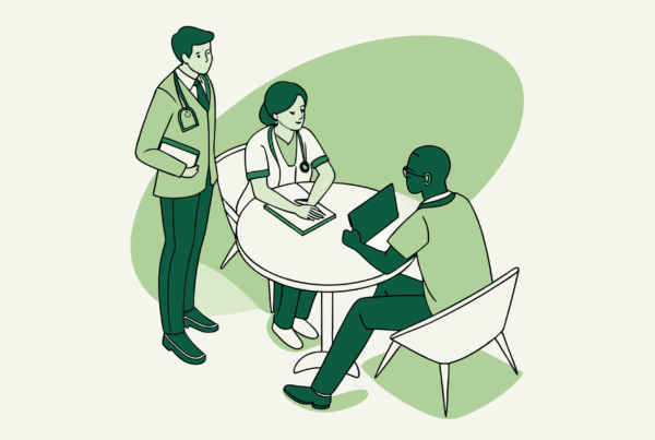 Business professionals and healthcare provider discussing palliative care practice mergers and acquisitions around a digital projection - SovDoc healthcare M&A advisory services supporting medical practice transitions.