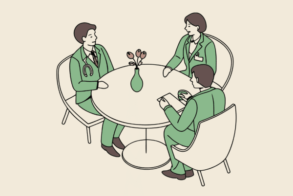 Professional roundtable discussion between legal and medical advisors discussing pediatric physical therapy practice mergers and acquisitions, with a model facility at center - SovDoc healthcare M&A consultation representing medical practice consolidation expertise.