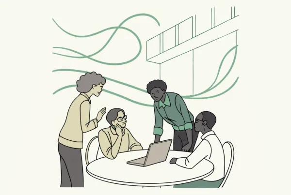 Healthcare professionals collaborate around a conference table with a memory care center design in the background, representing SovDoc's expertise in compliance and M&A advisory services for memory care facilities.