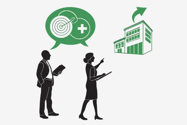 Illustration showing business figures discussing skilled nursing facility acquisitions with SovDoc, representing healthcare M&A advisors facilitating successful SNF mergers and growth opportunities in medical practice transactions.