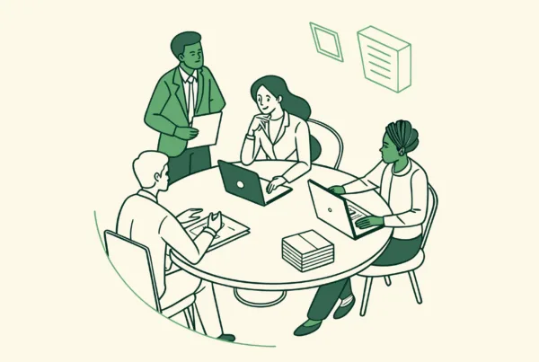 SovDoc healthcare consultants discussing hospice care mergers and acquisitions around a conference table, representing collaborative strategic planning in healthcare M&A.