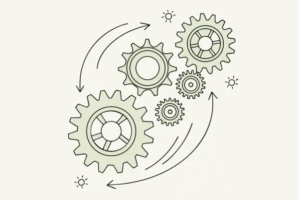 Interconnected gears with a glowing central hub and flowing data connections, representing SovDoc's healthcare M&A advisory network for palliative care EHR integration during medical practice mergers and acquisitions.
